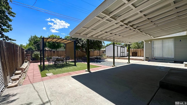 view of patio / terrace with a shed