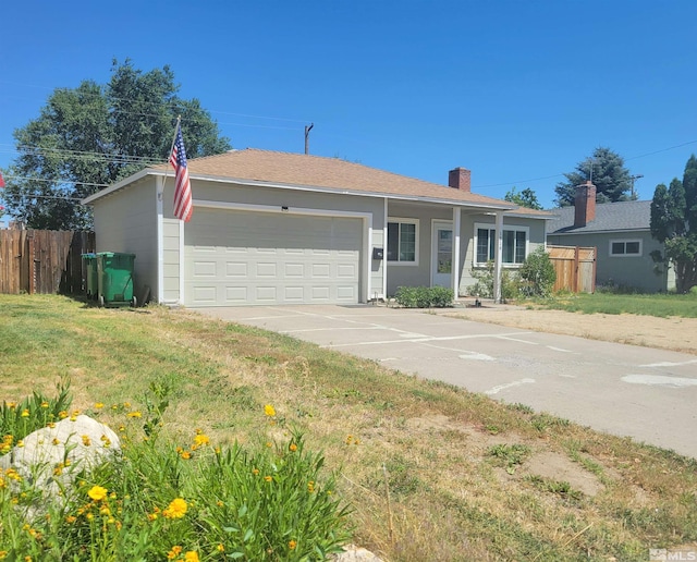 ranch-style home featuring a garage