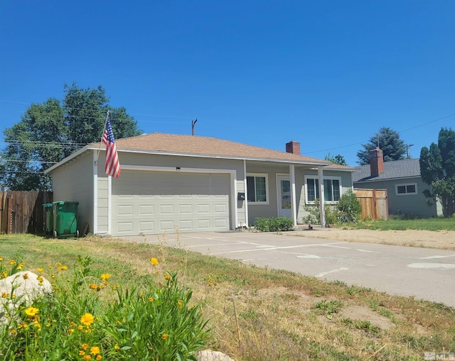 single story home featuring a garage