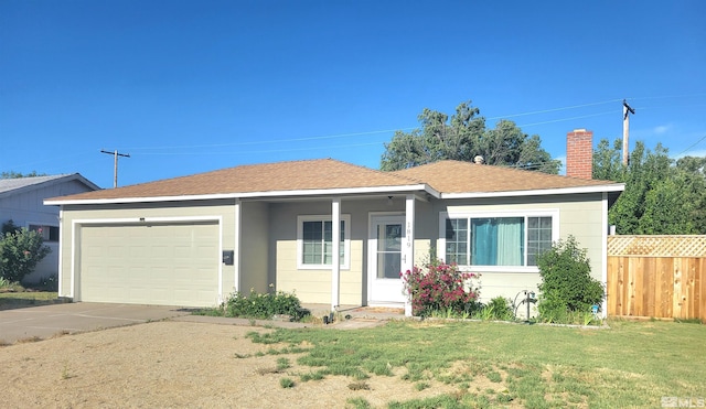 single story home featuring a front yard and a garage