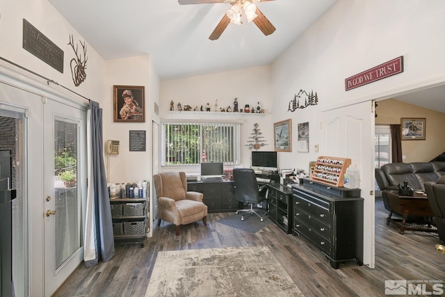 office space featuring dark hardwood / wood-style floors, ceiling fan, and lofted ceiling