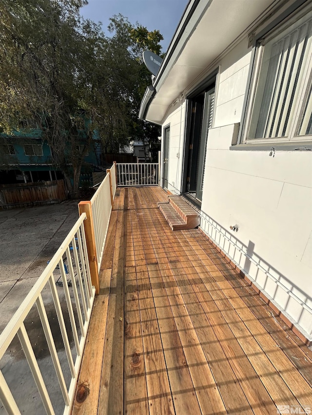 wooden terrace featuring a patio area