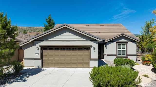 ranch-style house featuring a garage