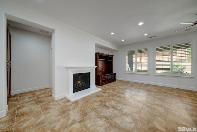 unfurnished living room with crown molding and ceiling fan