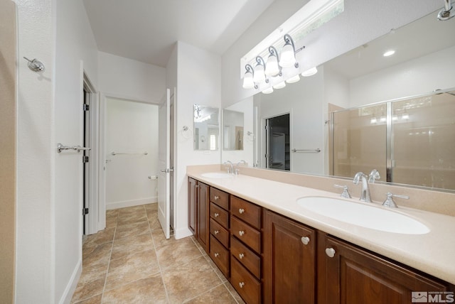 bathroom featuring vanity and an enclosed shower