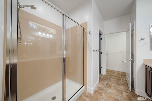 bathroom featuring vanity and an enclosed shower