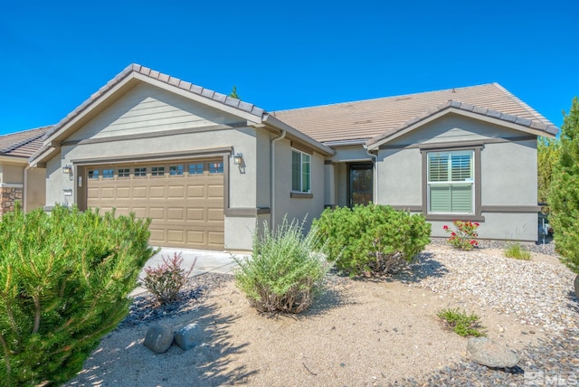 ranch-style home featuring a garage