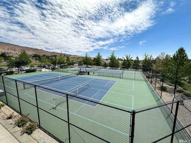 view of sport court with a mountain view