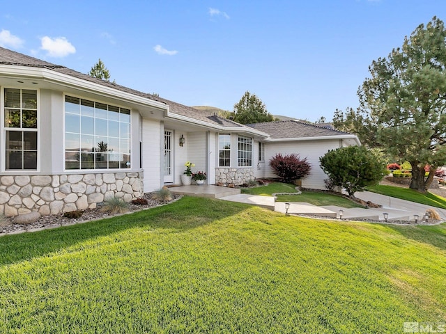 ranch-style house with a front yard