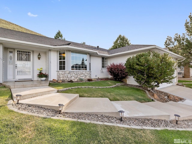 ranch-style house with a front yard