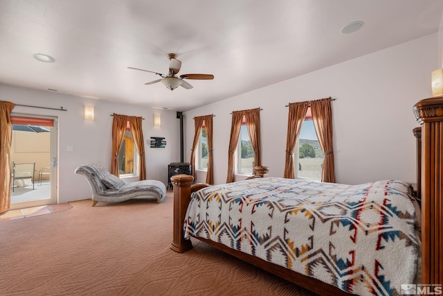 bedroom with carpet, ceiling fan, and access to exterior