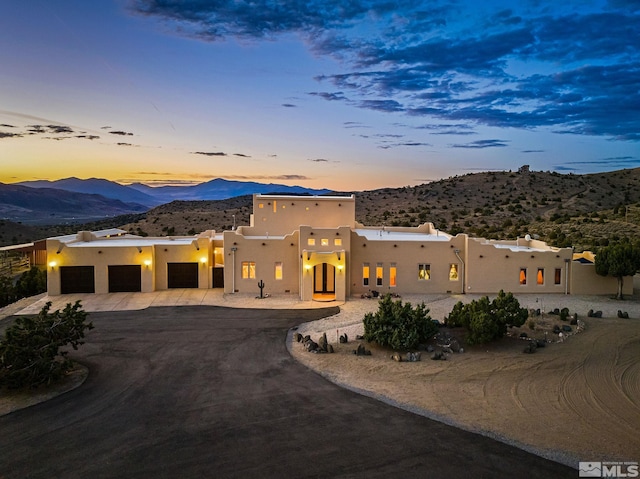 pueblo-style home featuring a mountain view