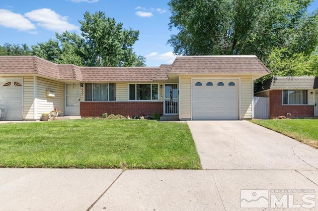 single story home featuring a front yard and a garage