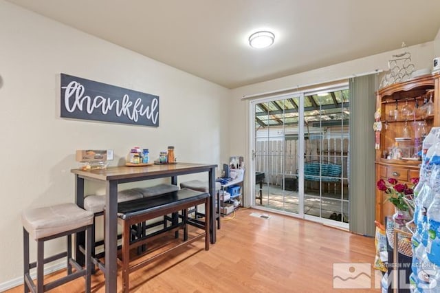 dining area with wood-type flooring