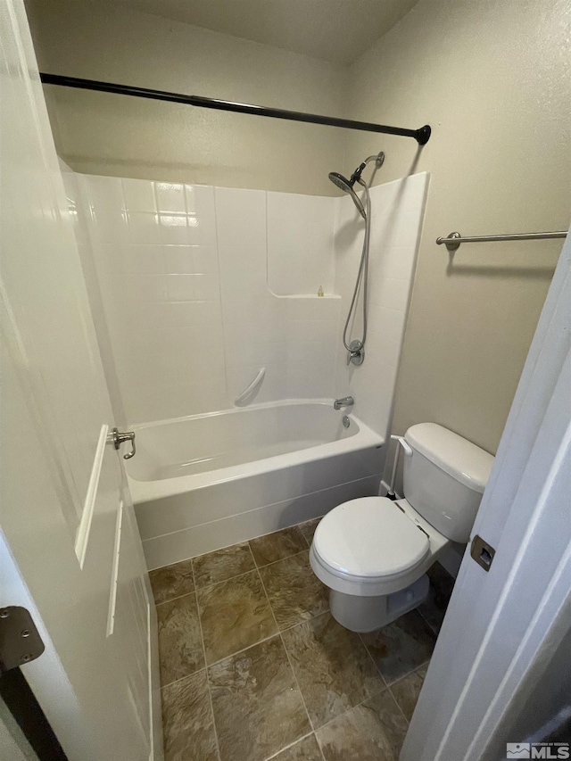 bathroom with toilet and shower / washtub combination