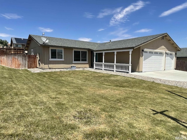 single story home with a front yard and a garage