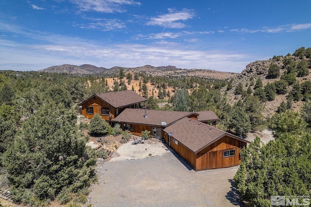 birds eye view of property with a mountain view