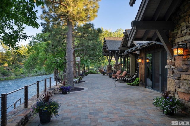 view of patio / terrace with a water view