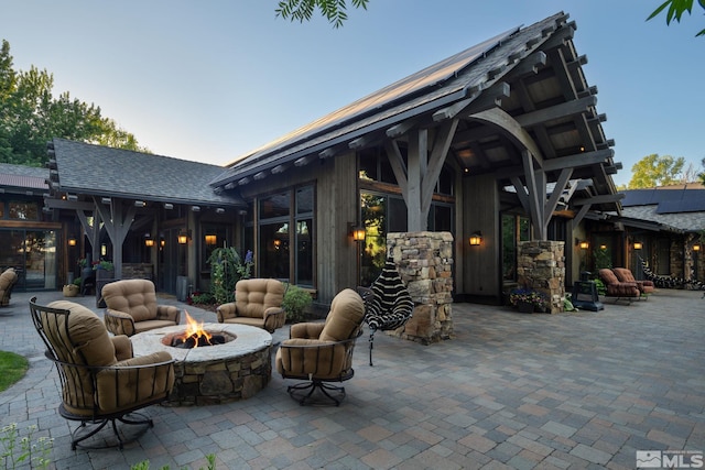 view of patio with an outdoor fire pit