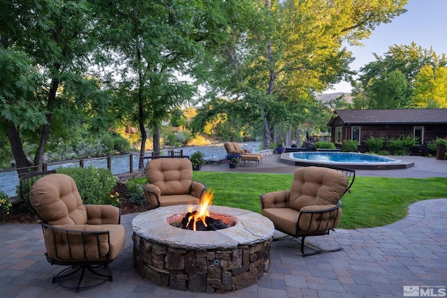 view of patio with a fire pit