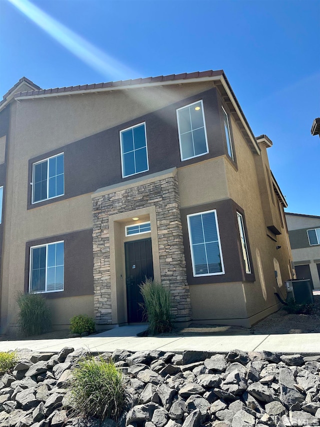 view of front of home with central AC unit