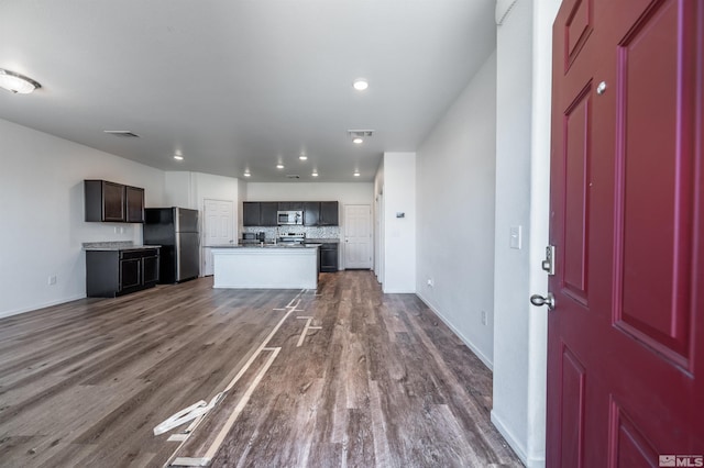 unfurnished living room with dark wood-type flooring