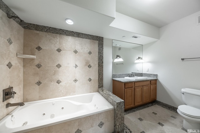 bathroom with vanity, tile patterned flooring, and toilet