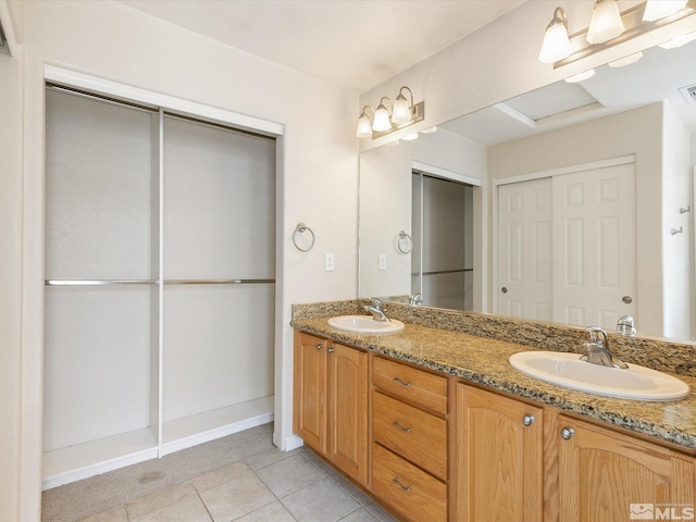 bathroom featuring tile patterned floors and vanity