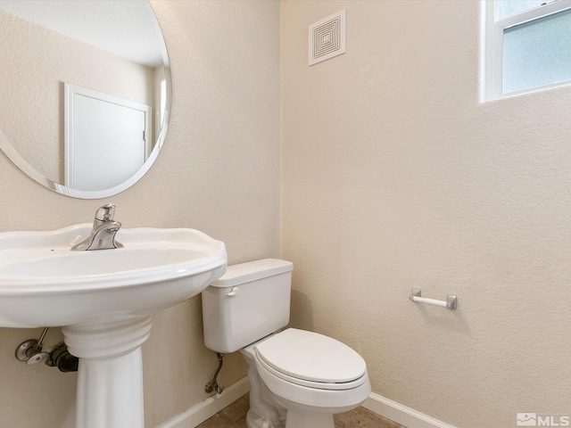 bathroom featuring toilet