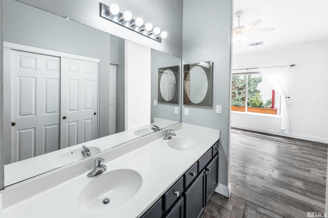 bathroom featuring ceiling fan, vanity, and hardwood / wood-style flooring