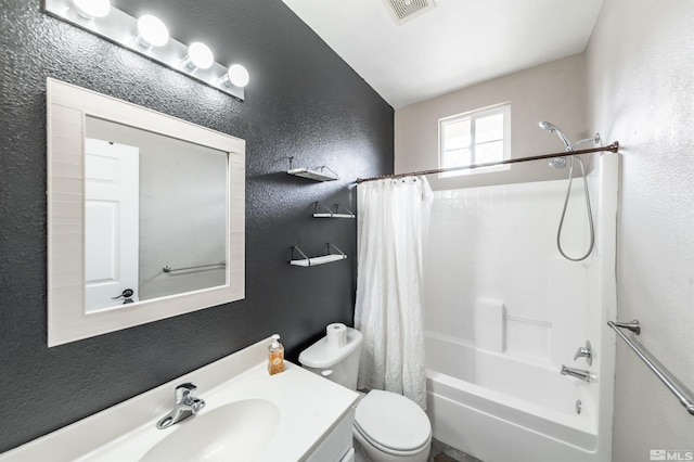 full bathroom featuring vanity, toilet, and shower / tub combo with curtain