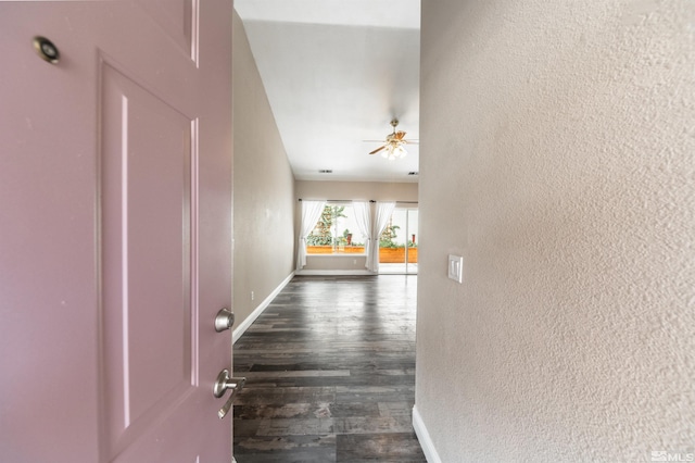 corridor with dark hardwood / wood-style floors