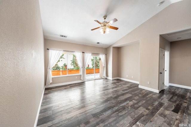 unfurnished room with dark hardwood / wood-style floors, vaulted ceiling, and ceiling fan