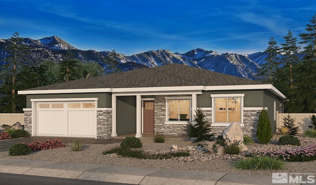 prairie-style house with a garage and a mountain view