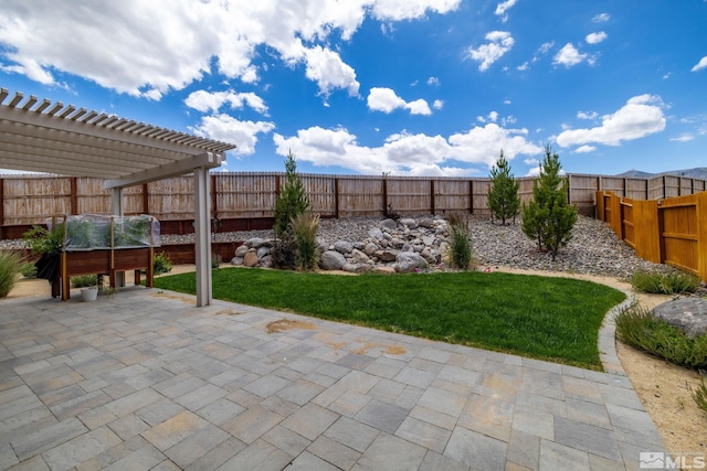 view of yard with a pergola and a patio area