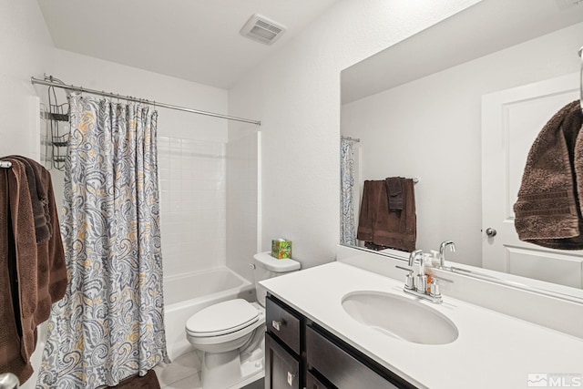 full bathroom with vanity, toilet, tile patterned flooring, and shower / tub combo