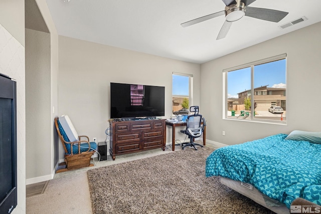 bedroom featuring light carpet and ceiling fan