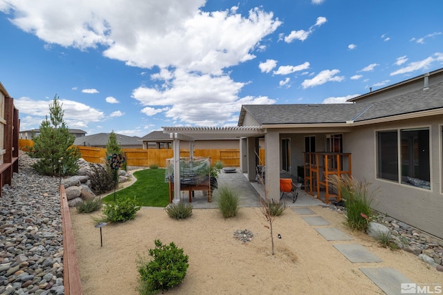 view of yard with a pergola and a patio area