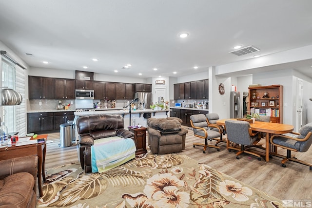 living room with light hardwood / wood-style flooring