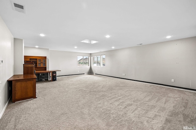 basement with light colored carpet