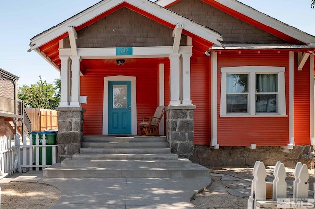 doorway to property featuring a porch