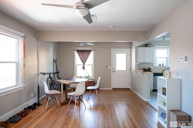 kitchen with white cabinets, light tile floors, and stainless steel dishwasher