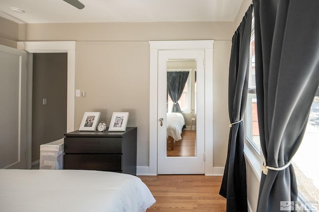 bedroom with ceiling fan and light hardwood / wood-style flooring