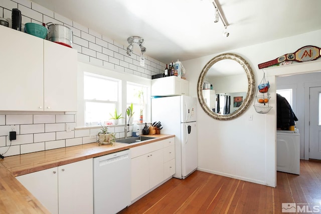 kitchen featuring light hardwood / wood-style floors, white cabinetry, white appliances, and butcher block counters