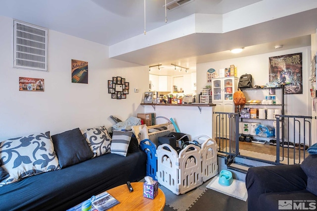 living room featuring visible vents