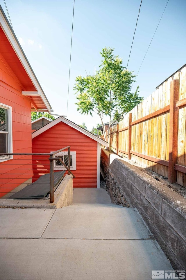 view of property exterior featuring fence