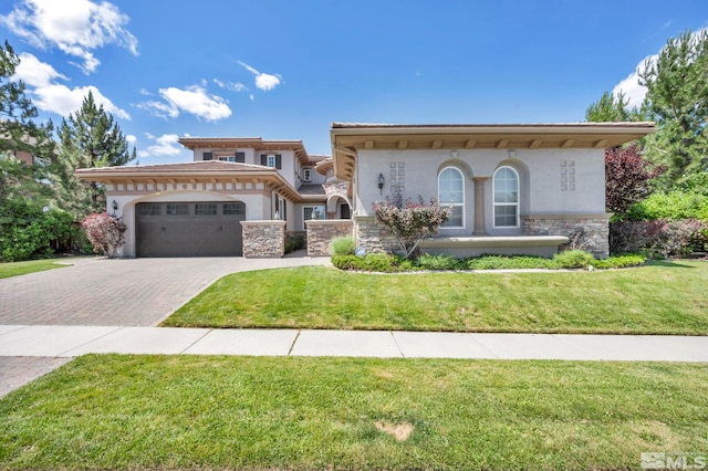 view of front facade with a front yard and a garage