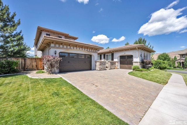 view of front of home with a garage and a front yard