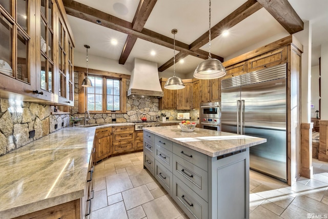 kitchen featuring custom exhaust hood, hanging light fixtures, gray cabinets, a large island, and stainless steel appliances