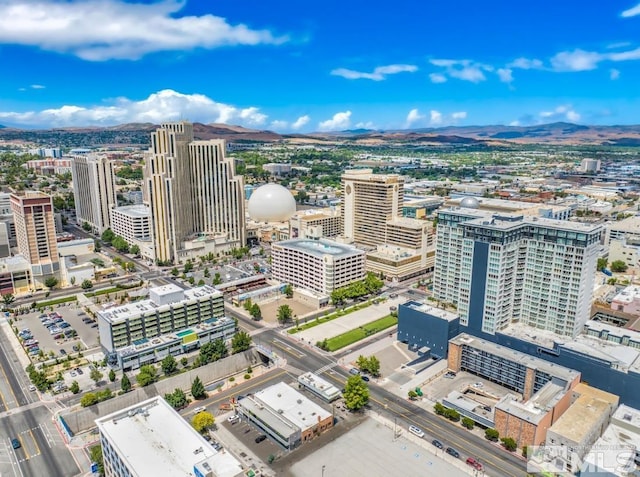 birds eye view of property with a mountain view